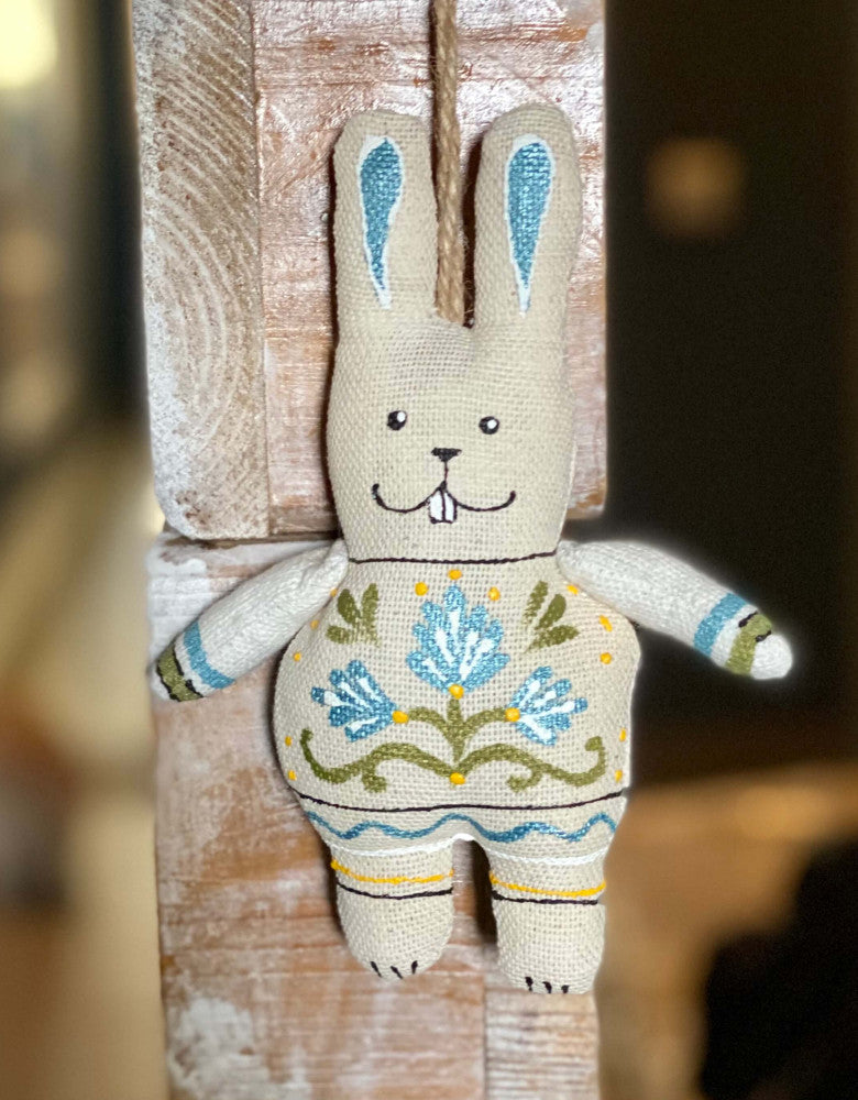 Souvenir "Hare with paws with blue flowers (vanilla)"