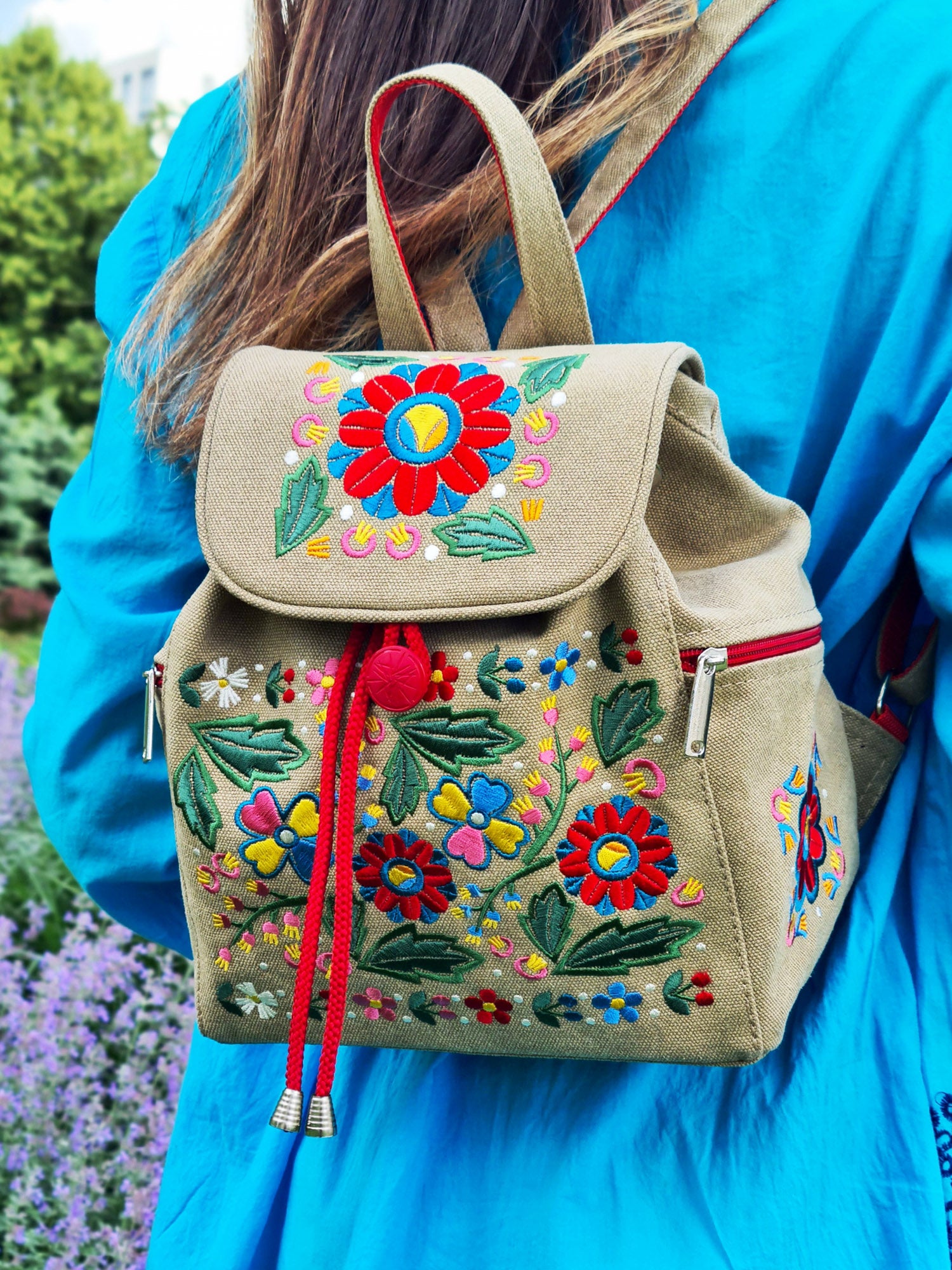 Backpack with "Unconquered" embroidery, beige