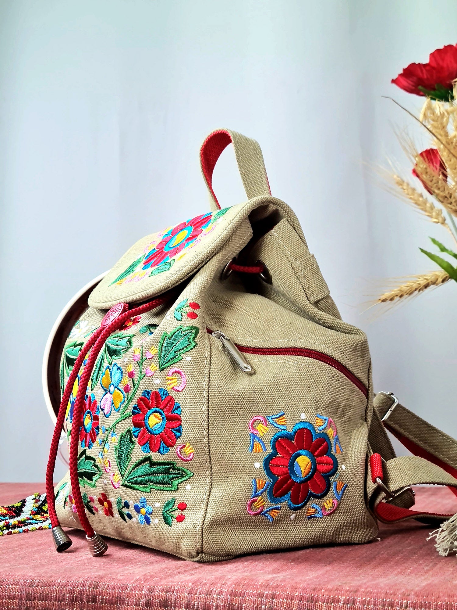 Backpack with "Unconquered" embroidery, beige
