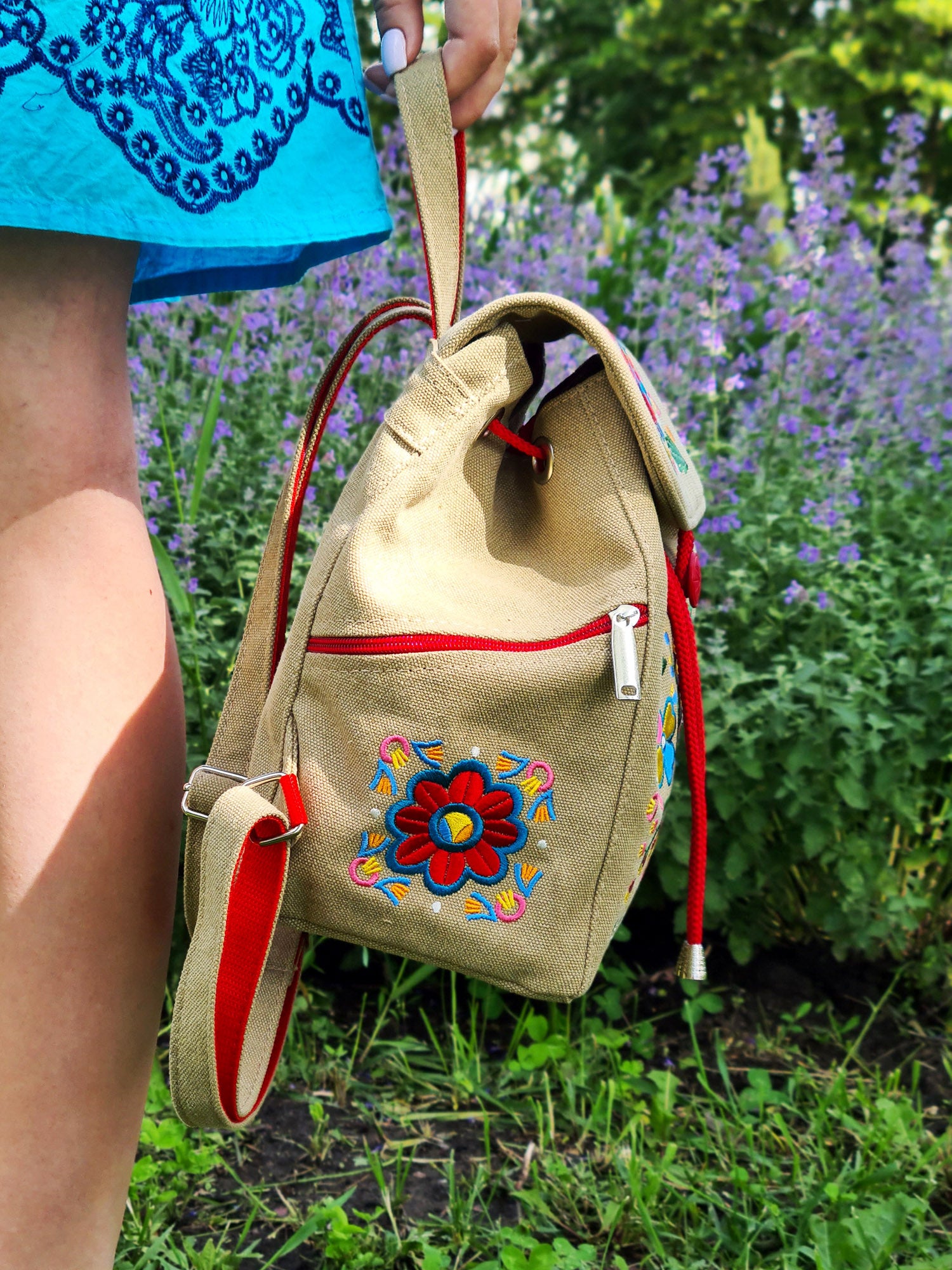 Backpack with "Unconquered" embroidery, beige