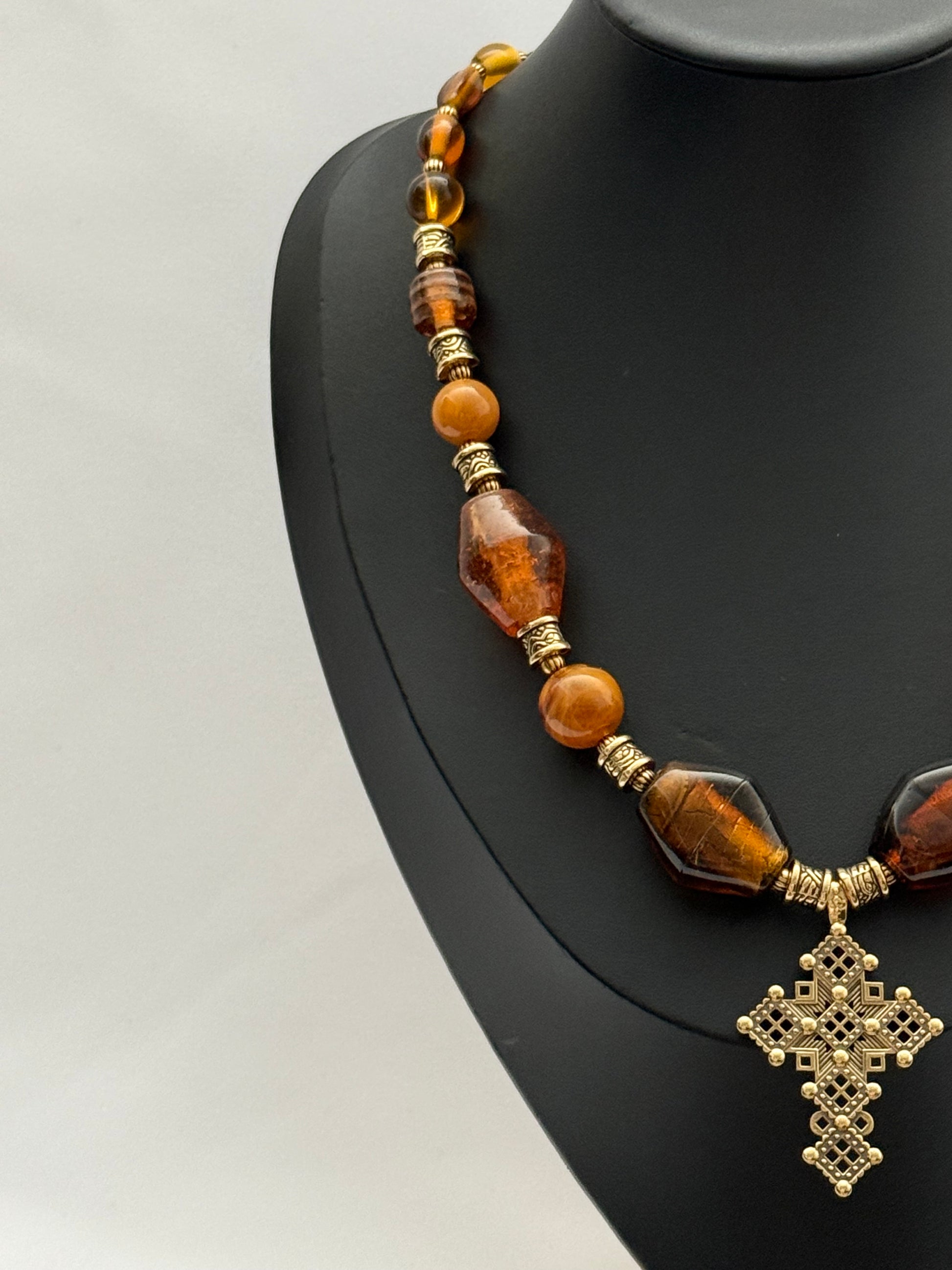 Amber Murano Glass Necklace with Brass Cross Pendant