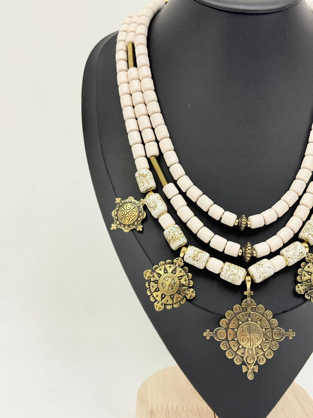 Three-Strand Traditional Ukrainian Necklace with Light Kosiv Ceramic and Brass Zgarda Crosses