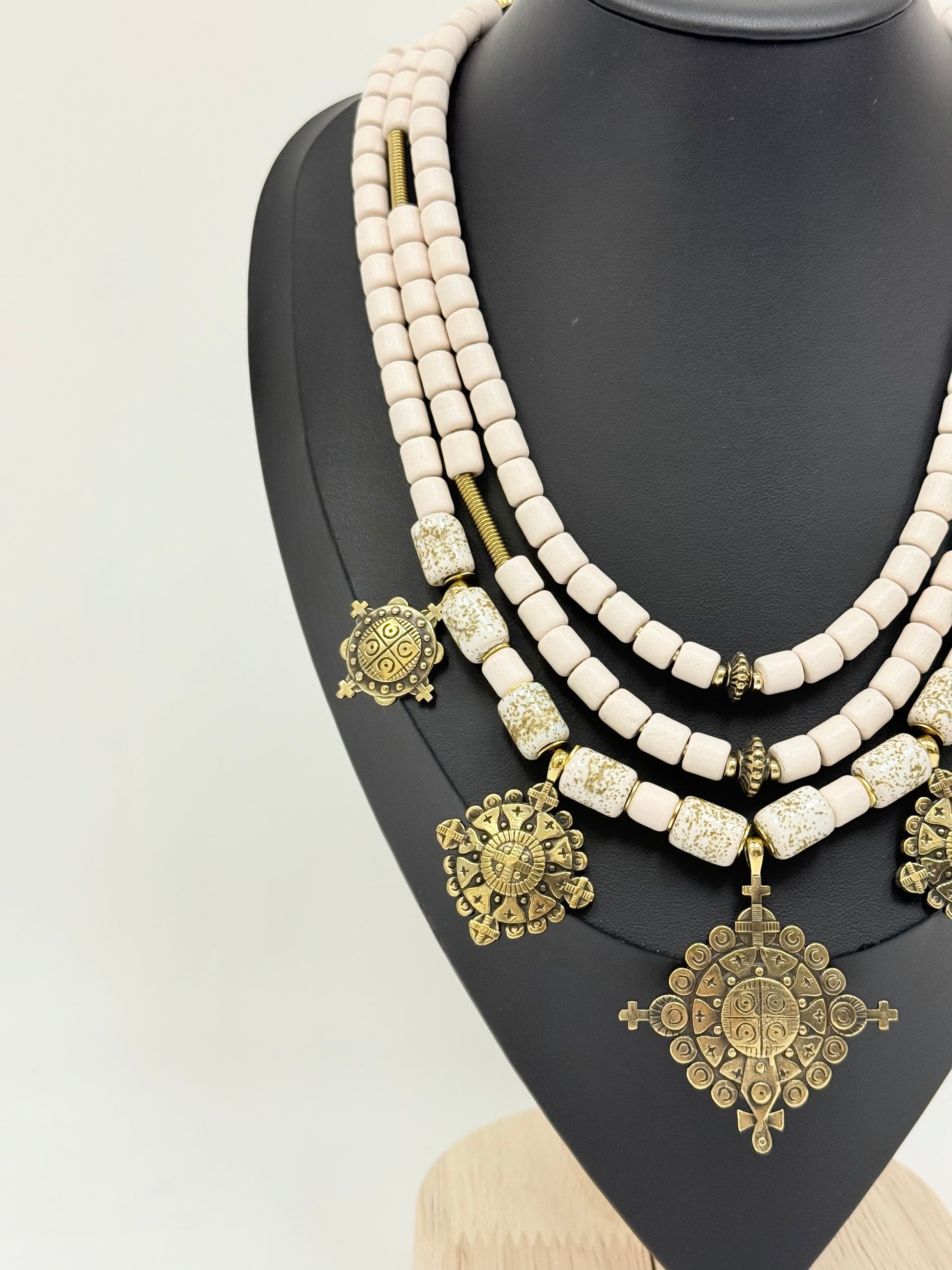Three-Strand Traditional Ukrainian Necklace with Light Kosiv Ceramic and Brass Zgarda Crosses