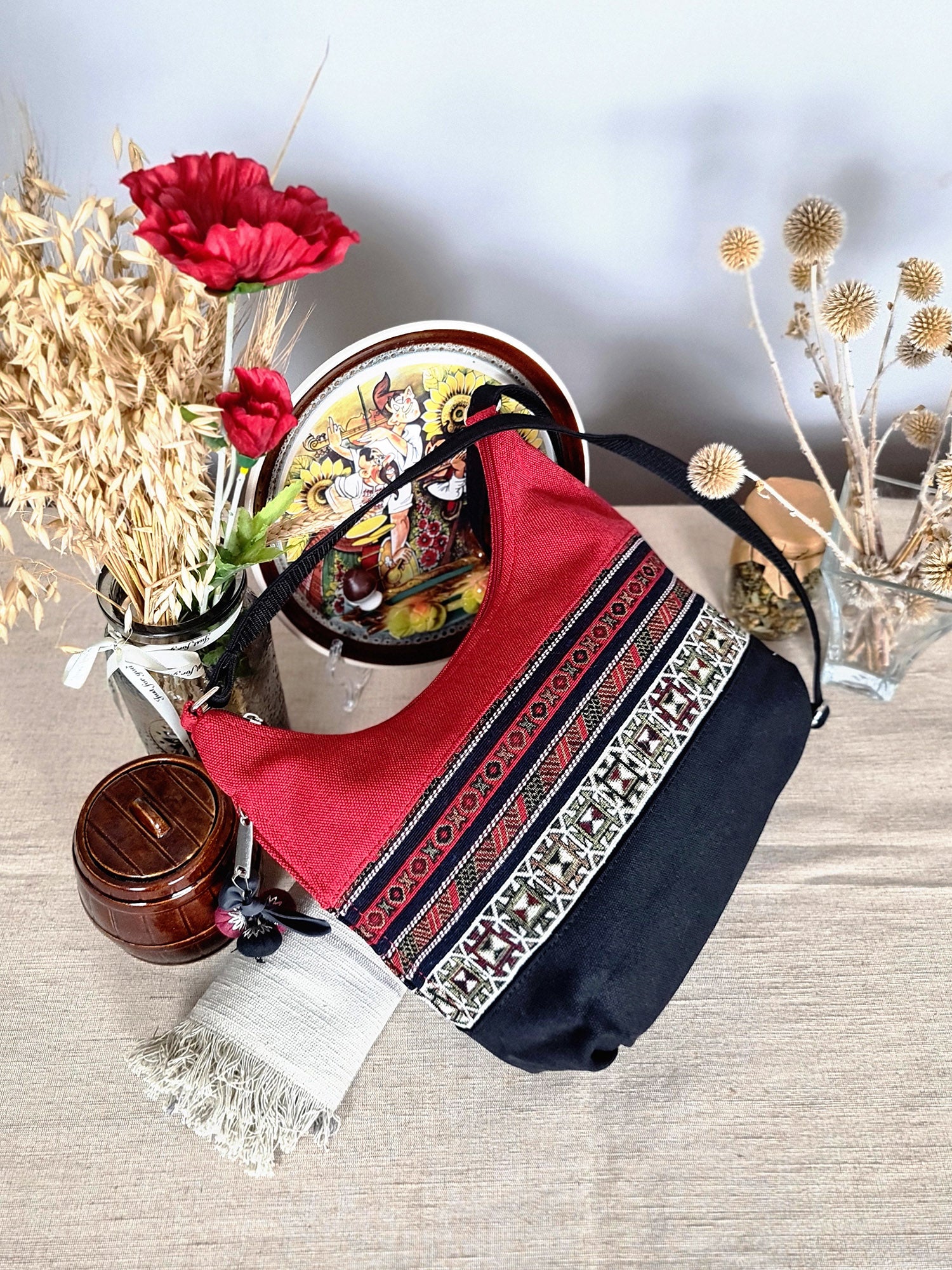 The bag is red and black with ethnic ornament