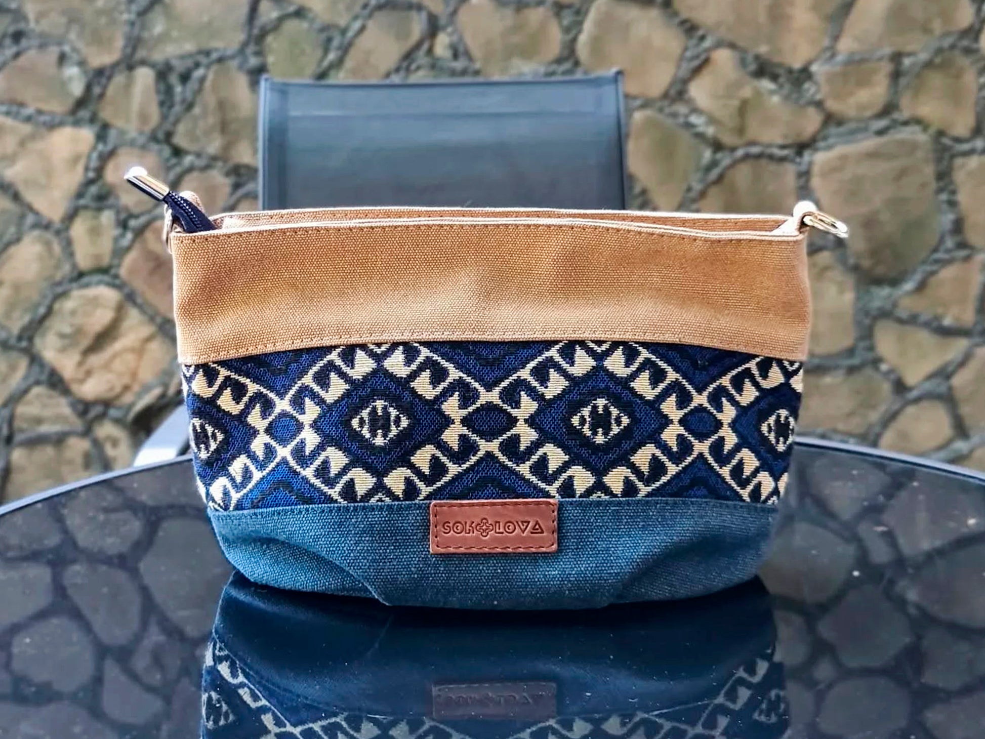 A small Ethno handbag with a blue ornament