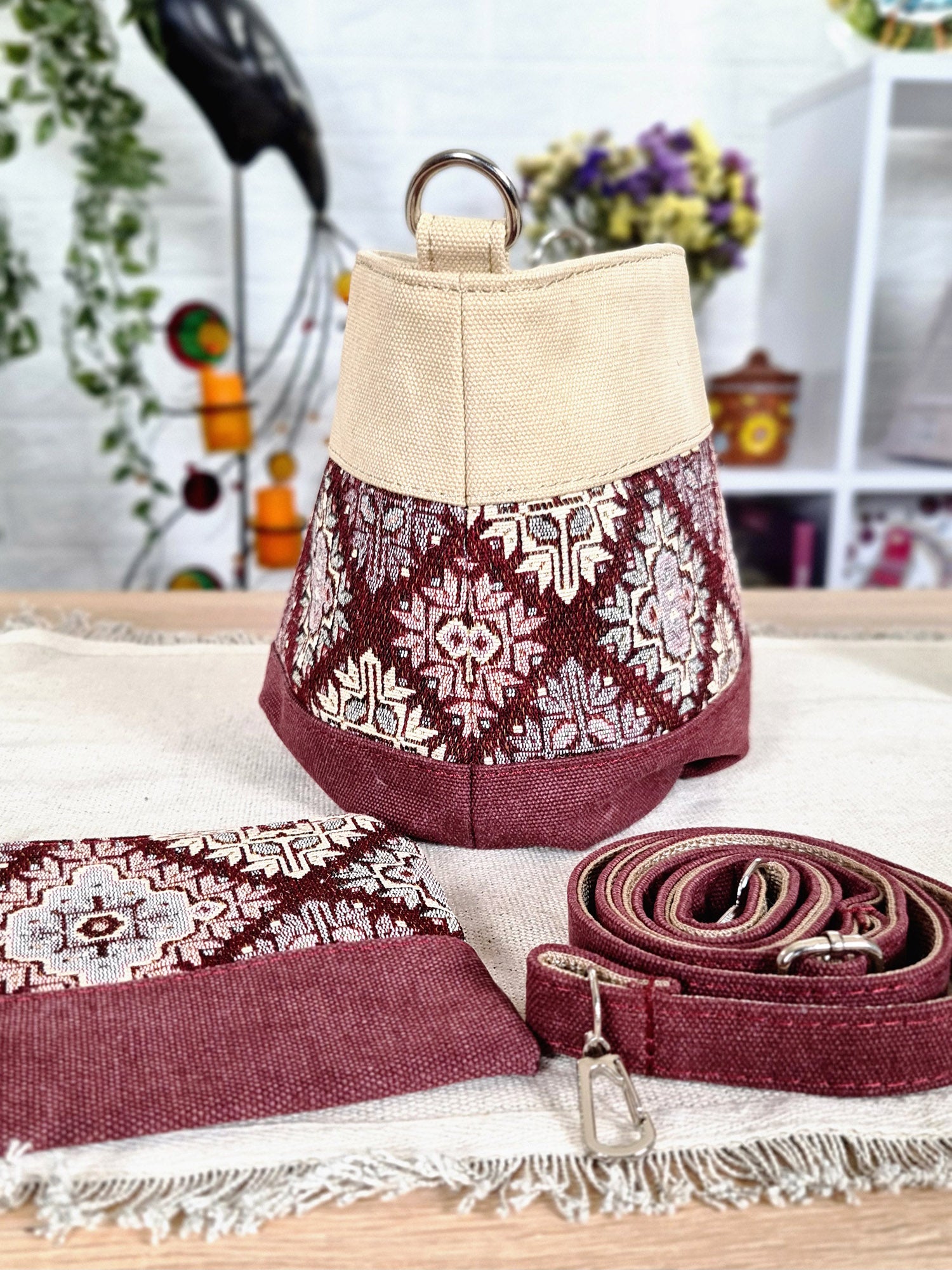 A small bag with a burgundy ornament
