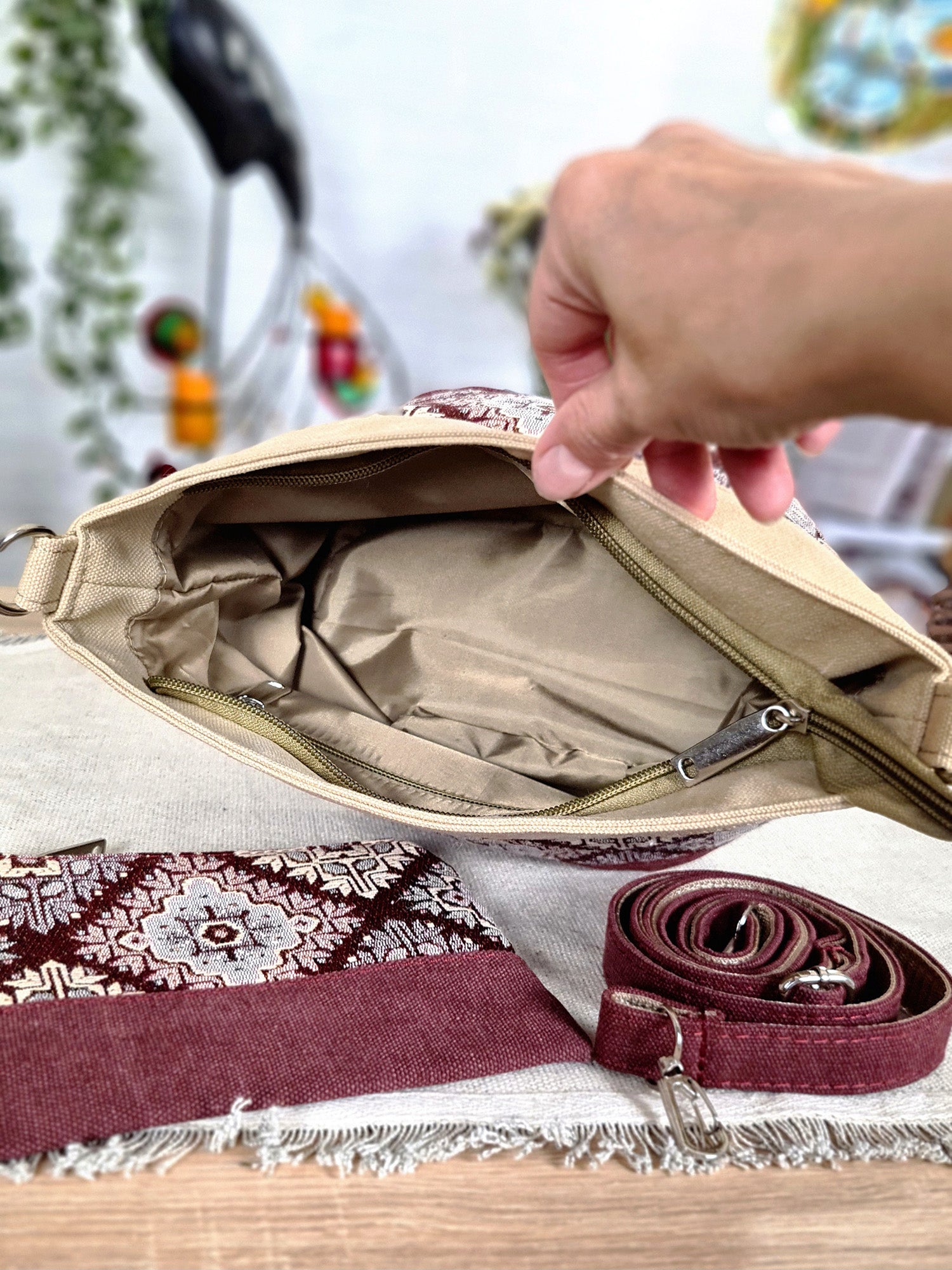 A small bag with a burgundy ornament
