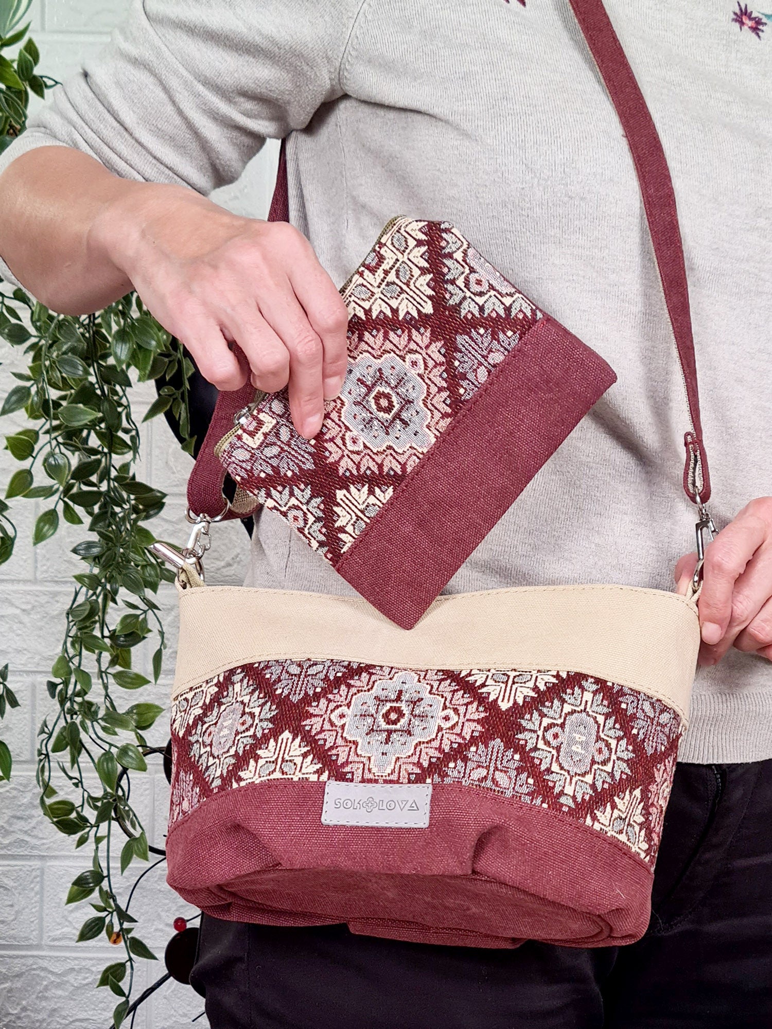 A small bag with a burgundy ornament